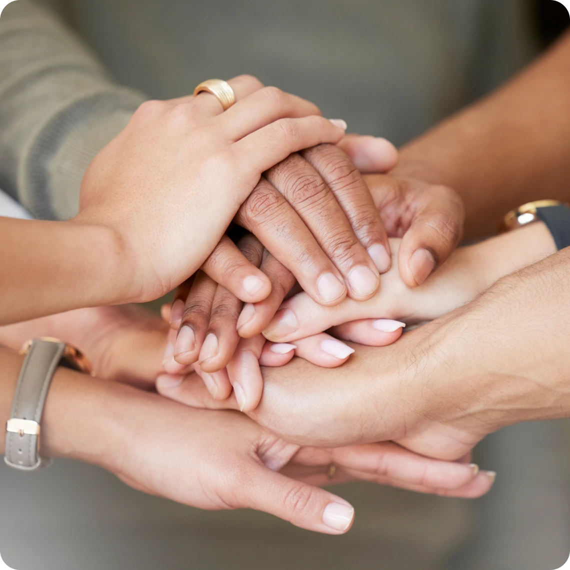 Diverse hands stacked together